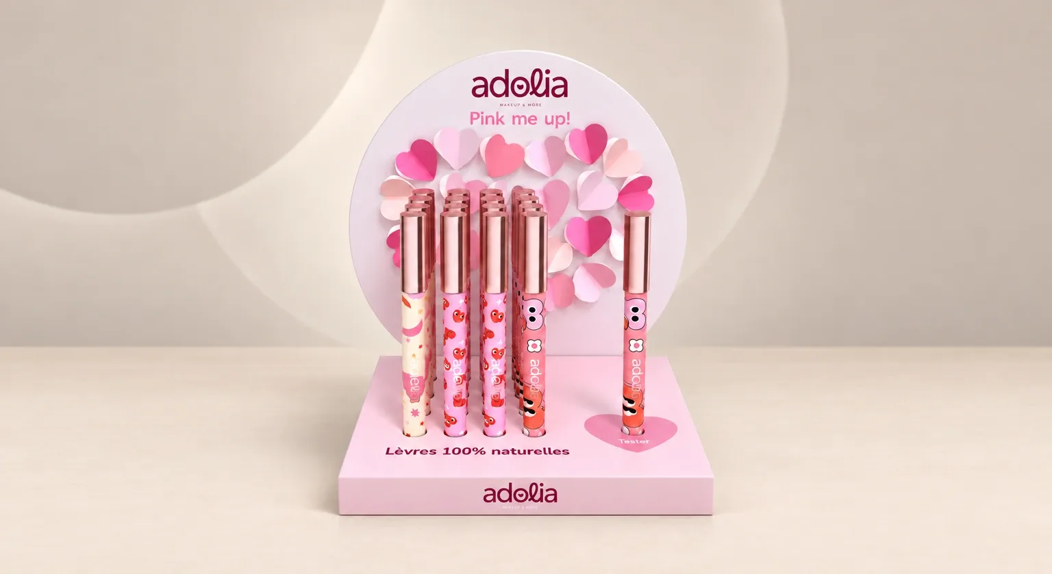 Expositor cosmético rosa en forma de corazón para barras de labios, con corazones de papel en volumen